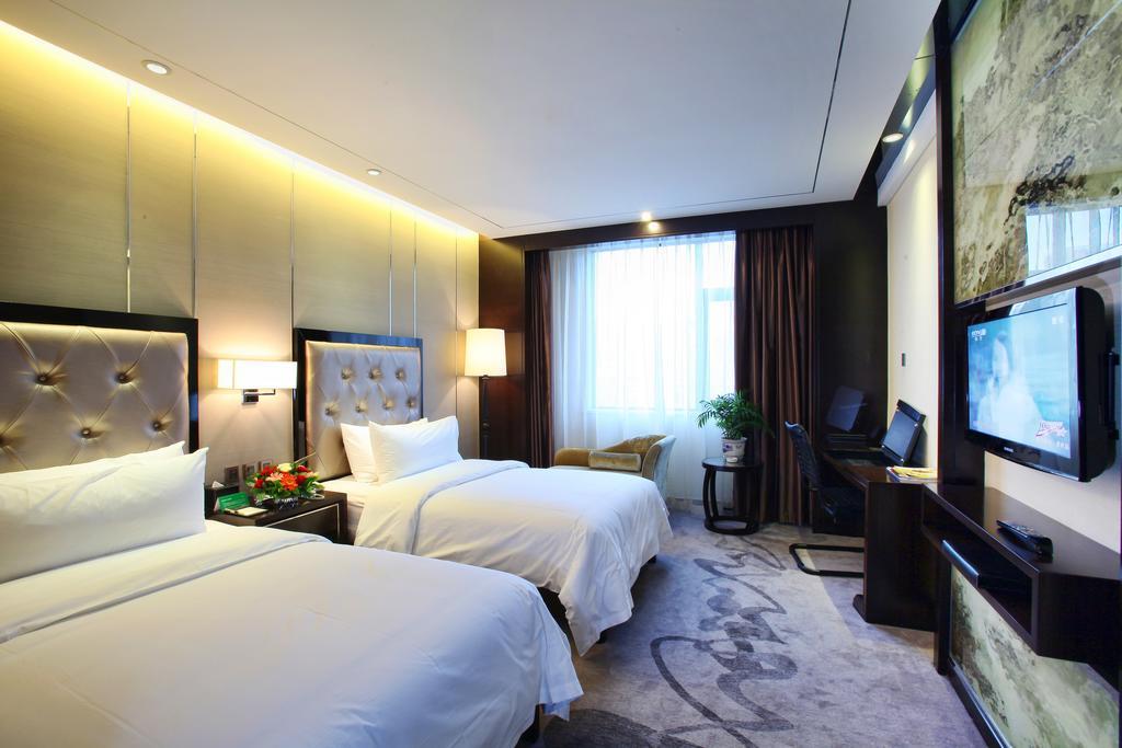 Xichang Minshan Hotel Quarto foto